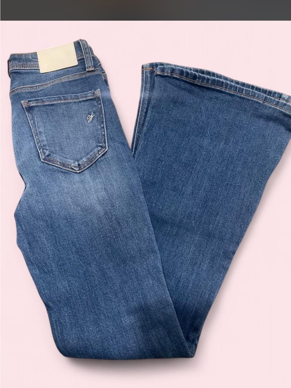 Carly Jean Los Angeles Mid-Rise Flare Jeans in dark blue denim